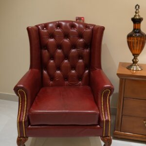 Classic Leather Wingback Chair with Burgundy Upholstery, Deep Button Tufting and Carved Wooden Legs